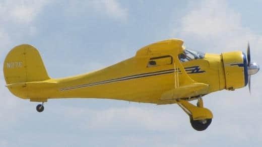 Yellow plane flying in the air, Beechcraft D17S Yellow plane flying in the air, Beechcraft D17S